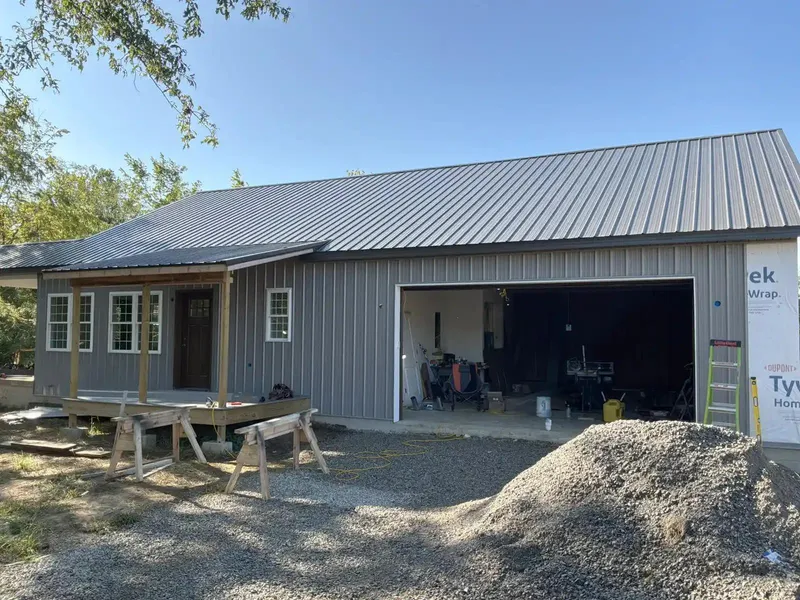 front facade view with metal exterior and metal roof