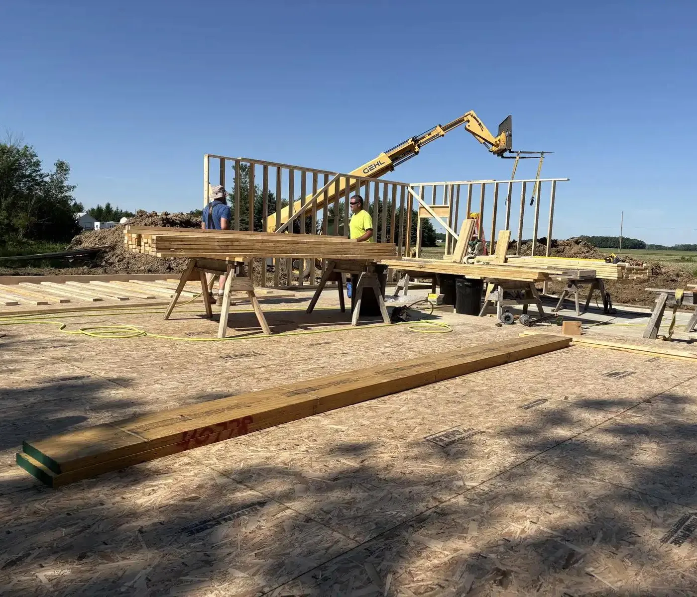 construction crew setting up frames for a residential build