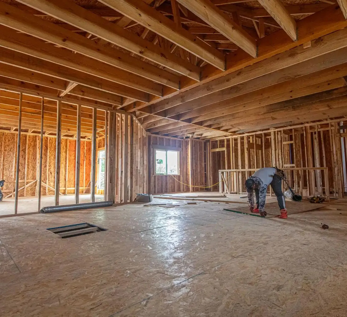 working in a framed house preparing to cut wood