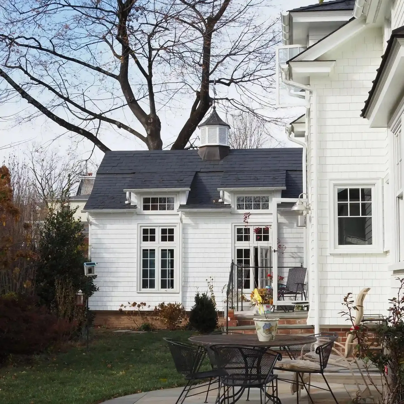 a quaint home addition built with a view of the backyard