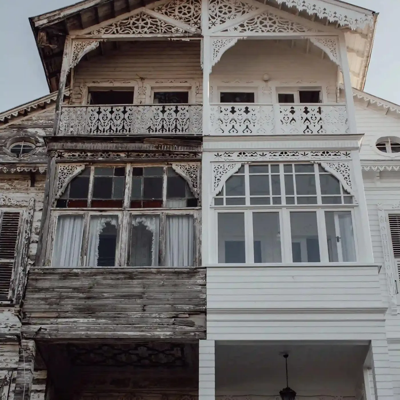 image of a house cut in half with left side old and decrepit, right side is bright and renovated