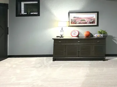 credenza against a wall with an Ohio State University clock and picture of the OSU Stadium
